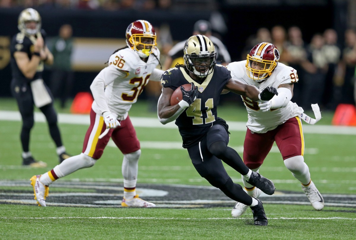New Orleans Saints running back Alvin Kamara (41) runs from the Washington Redskins defense. Mandatory Credit: Chuck Cook-USA TODAY
